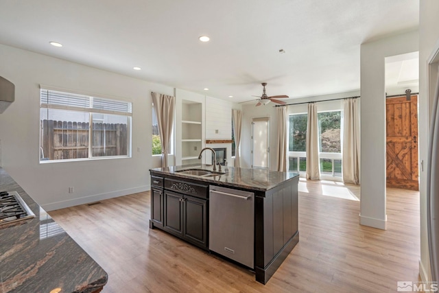 2705 Wind Feather Trl, Reno, NV 89511 - kitchen featuring a sink, appliances with stainless steel finishes, light wood-type flooring, ceiling fan, and recessed lighting