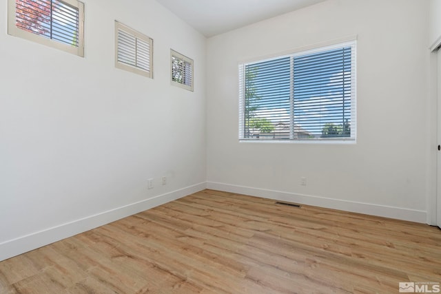 2705 Wind Feather Trl, Reno, NV 89511 - unfurnished room featuring light wood-type flooring and baseboards