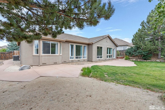 2705 Wind Feather Trl, Reno, NV 89511 - back of property with a patio, central AC unit, and stucco siding
