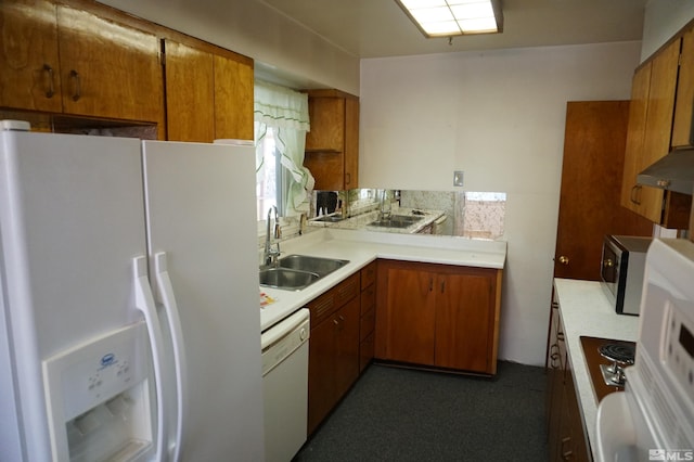 933 Cordone Ave, Reno, NV 89502 - kitchen with appliances with stainless steel finishes, a sink, brown cabinetry, and light countertops