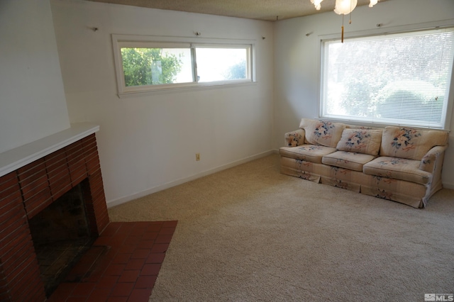 933 Cordone Ave, Reno, NV 89502 - living room featuring carpet, a brick fireplace, and baseboards