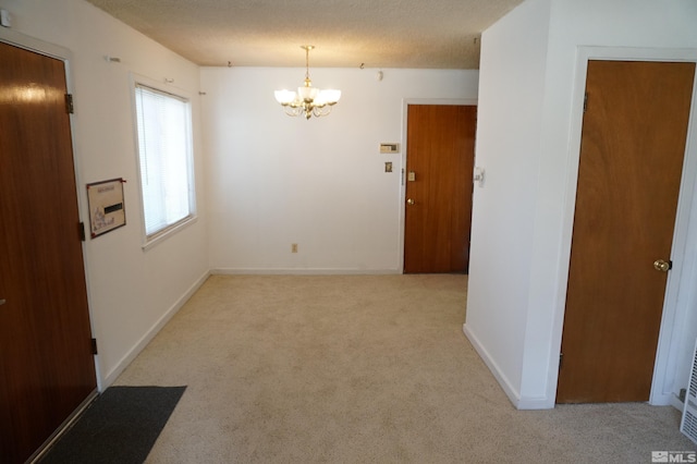 933 Cordone Ave, Reno, NV 89502 - carpeted spare room featuring a chandelier and baseboards