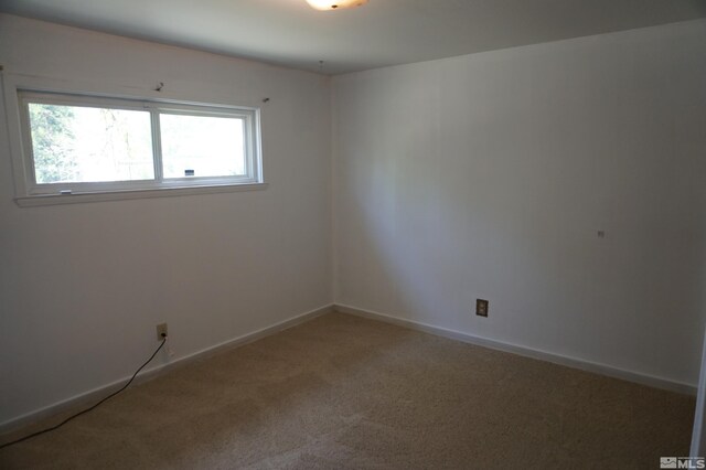 933 Cordone Ave, Reno, NV 89502 - empty room featuring light carpet and baseboards
