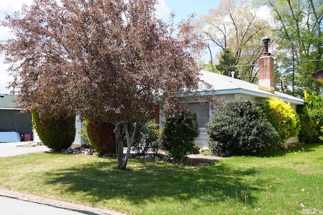 933 Cordone Ave, Reno, NV 89502 - view of front of home featuring a front yard and a chimney