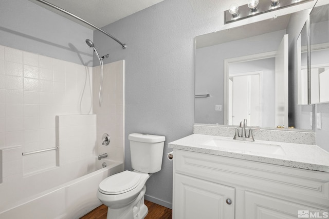 5645 Vista Luna Dr Apt 101, Sparks, NV 89436 - full bath with wood finished floors, toilet, vanity,  shower combination, and a textured wall