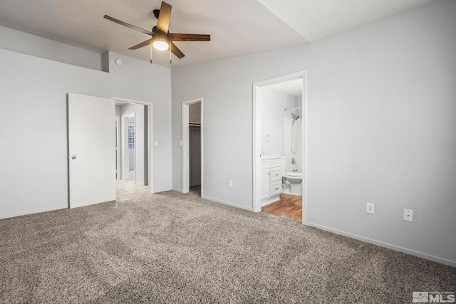 5645 Vista Luna Dr Apt 101, Sparks, NV 89436 - unfurnished bedroom with carpet flooring, a spacious closet, ensuite bath, a closet, and baseboards