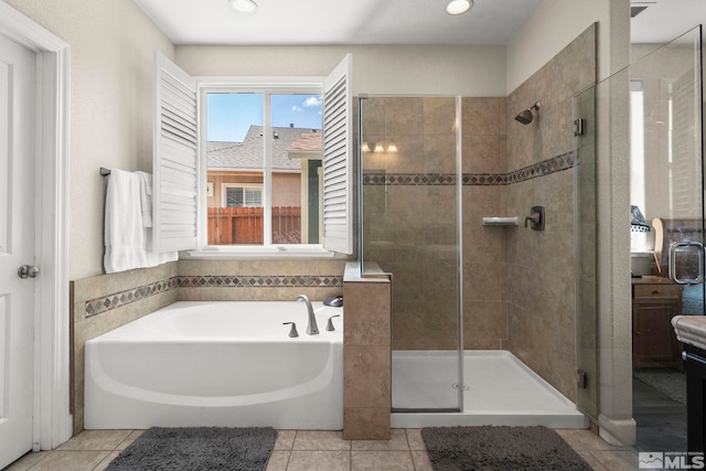 780 Ahwanee Dr, Sparks, NV 89436 - bathroom featuring a shower stall, a garden tub, tile patterned floors, and recessed lighting