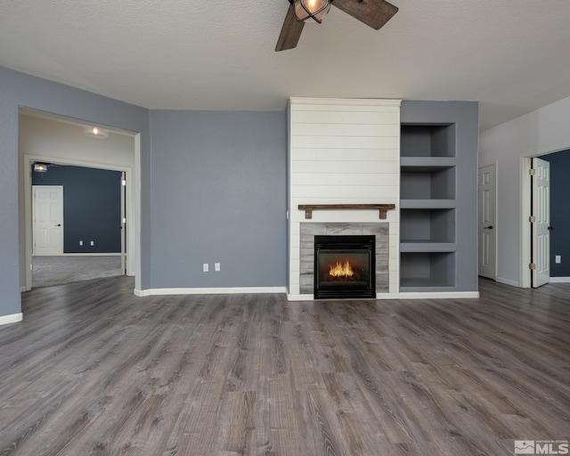 326 Torrey Pines Dr, Dayton, NV 89403 - unfurnished living room featuring a ceiling fan, baseboards, wood finished floors, built in features, and a textured ceiling