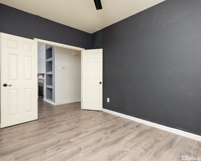 326 Torrey Pines Dr, Dayton, NV 89403 - unfurnished bedroom with wood finished floors, baseboards, and a ceiling fan