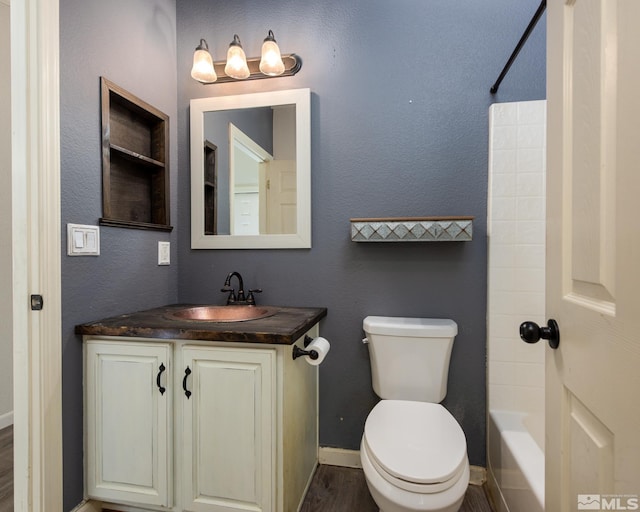 326 Torrey Pines Dr, Dayton, NV 89403 - bathroom featuring vanity, toilet, wood finished floors, baseboards, and shower / washtub combination