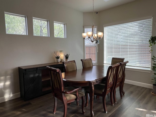 684 Rose Ln, Fernley, NV 89408 - dining area featuring a chandelier, dark wood finished floors, and baseboards