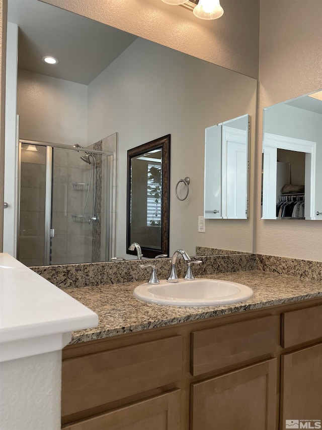 684 Rose Ln, Fernley, NV 89408 - bathroom featuring a shower stall and vanity