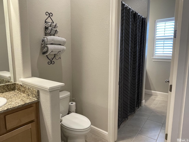684 Rose Ln, Fernley, NV 89408 - bathroom with toilet, tile patterned floors, vanity, and curtained shower
