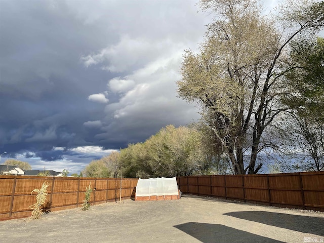 684 Rose Ln, Fernley, NV 89408 - fenced backyard with a greenhouse