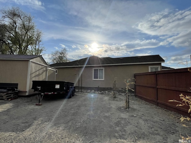 684 Rose Ln, Fernley, NV 89408 - view of home's exterior featuring fence and an outdoor structure