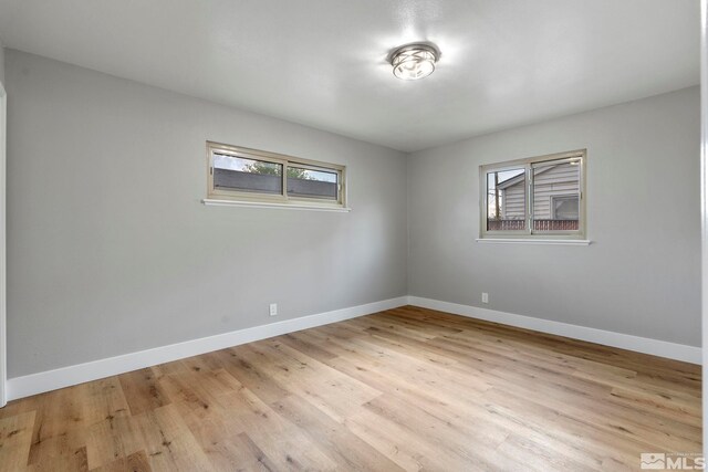 1365 Prospect Ave, Sparks, NV 89431 - unfurnished room with healthy amount of natural light, baseboards, and light wood finished floors