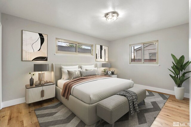 1365 Prospect Ave, Sparks, NV 89431 - bedroom featuring multiple windows, baseboards, and light wood finished floors