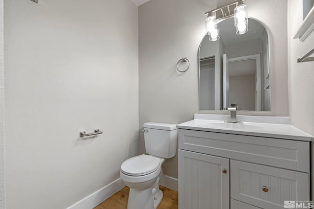 1365 Prospect Ave, Sparks, NV 89431 - half bathroom with wood finished floors, toilet, baseboards, and vanity