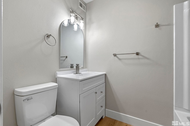 1365 Prospect Ave, Sparks, NV 89431 - bathroom featuring toilet, vanity, and wood finished floors