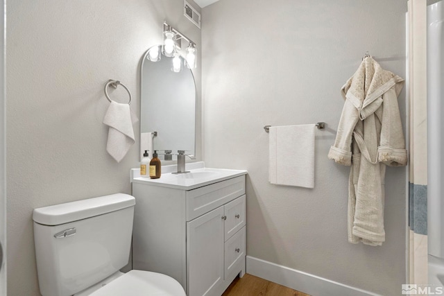 1365 Prospect Ave, Sparks, NV 89431 - bathroom featuring toilet, vanity, and wood finished floors