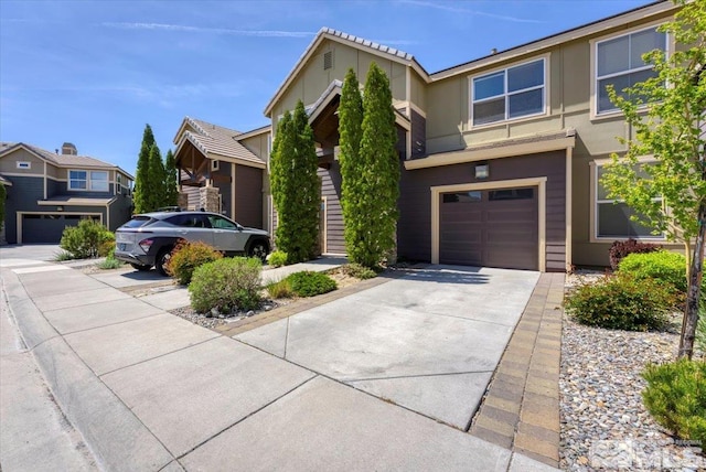 4889 Bougainvillea Cir, Sparks, NV 89436 - view of front facade with a garage, driveway, and stucco siding