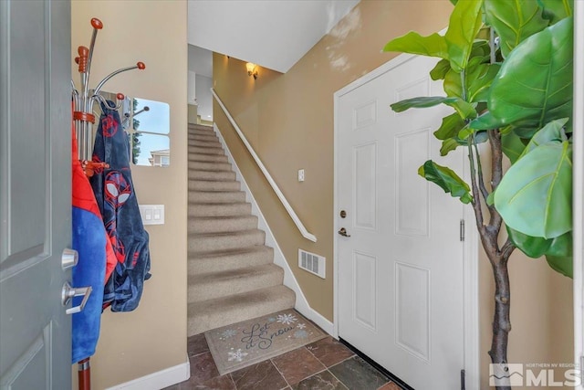4889 Bougainvillea Cir, Sparks, NV 89436 - foyer featuring stairs, baseboards, and stone finish flooring