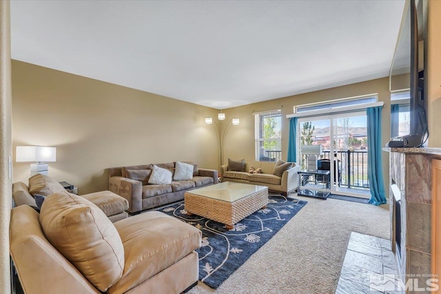 4889 Bougainvillea Cir, Sparks, NV 89436 - carpeted living room with a fireplace