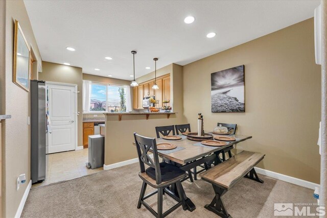 4889 Bougainvillea Cir, Sparks, NV 89436 - dining area featuring recessed lighting, light colored carpet, and baseboards