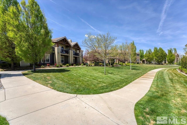 4889 Bougainvillea Cir, Sparks, NV 89436 - surrounding community with a yard