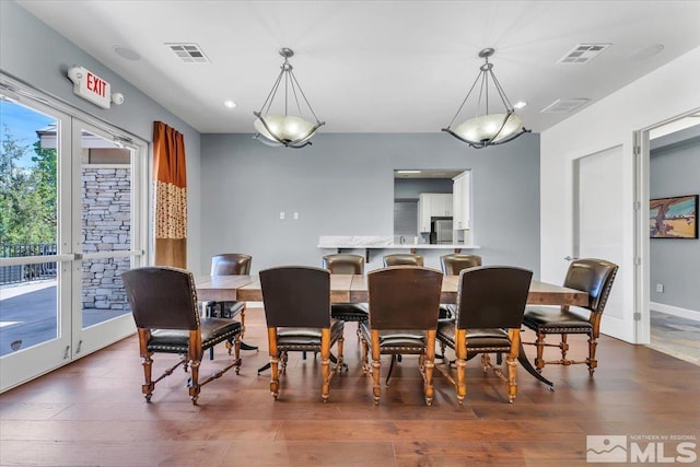 4889 Bougainvillea Cir, Sparks, NV 89436 - dining space featuring dark wood-type flooring and recessed lighting