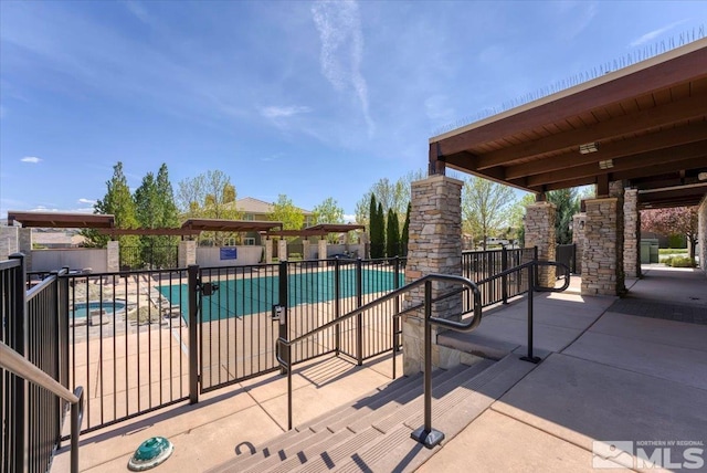 4889 Bougainvillea Cir, Sparks, NV 89436 - community pool with fence and a patio area
