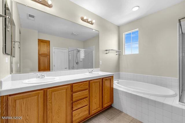 1095 S University Park Loop, Reno, NV 89512 - full bathroom with double vanity, a bath, a shower stall, and tile patterned floors