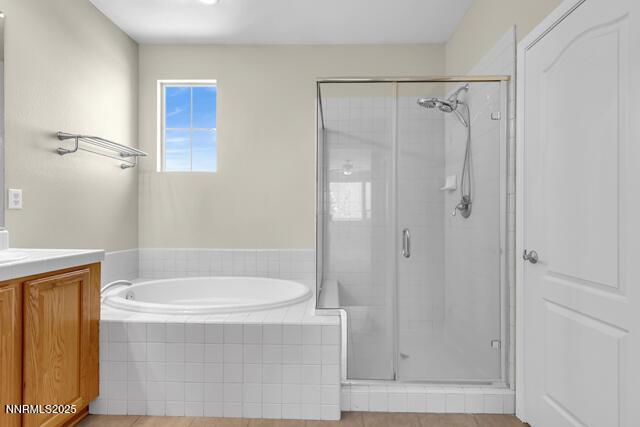 1095 S University Park Loop, Reno, NV 89512 - full bath with vanity, a stall shower, and a garden tub