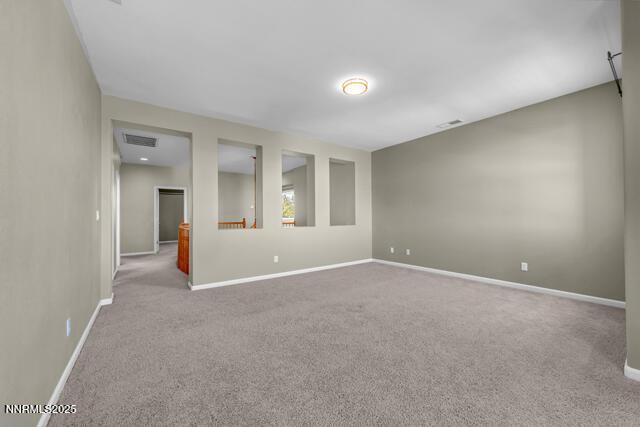 1095 S University Park Loop, Reno, NV 89512 - carpeted empty room featuring baseboards
