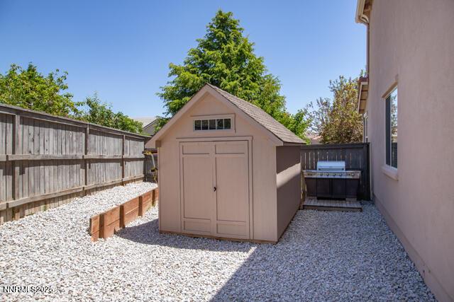 1095 S University Park Loop, Reno, NV 89512 - view of shed with a fenced backyard