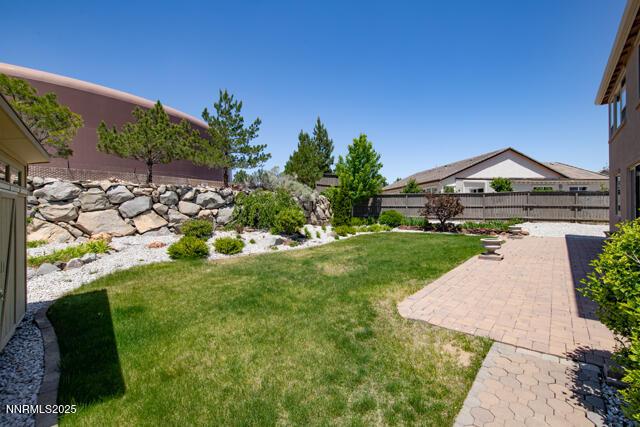 1095 S University Park Loop, Reno, NV 89512 - view of yard featuring a patio area