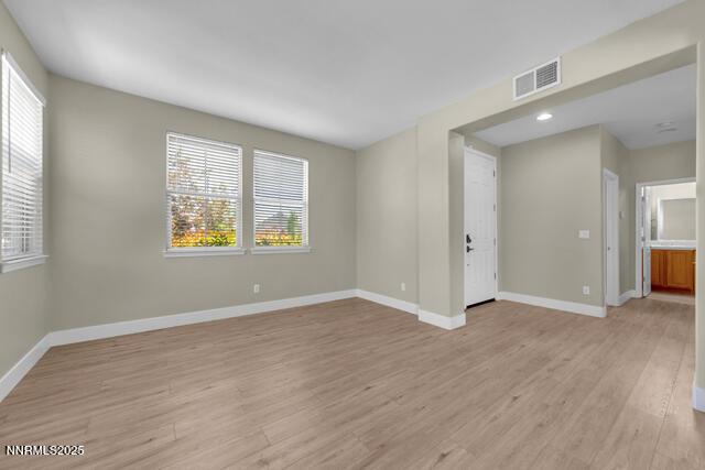 1095 S University Park Loop, Reno, NV 89512 - spare room with healthy amount of natural light, light wood-style floors, and baseboards