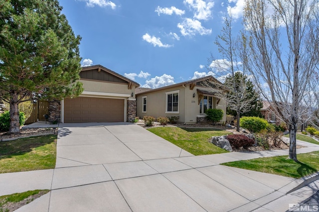 2370 Hickory Hl, Reno, NV 89523 - view of front facade featuring stucco siding, an attached garage, driveway, stone siding, and a front yard