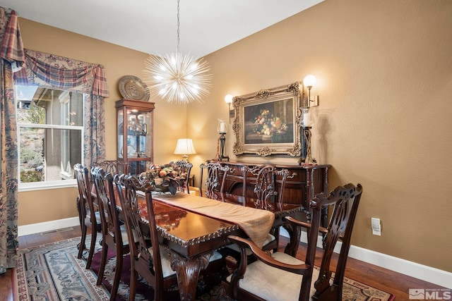 2370 Hickory Hl, Reno, NV 89523 - dining area with a chandelier, baseboards, and wood finished floors