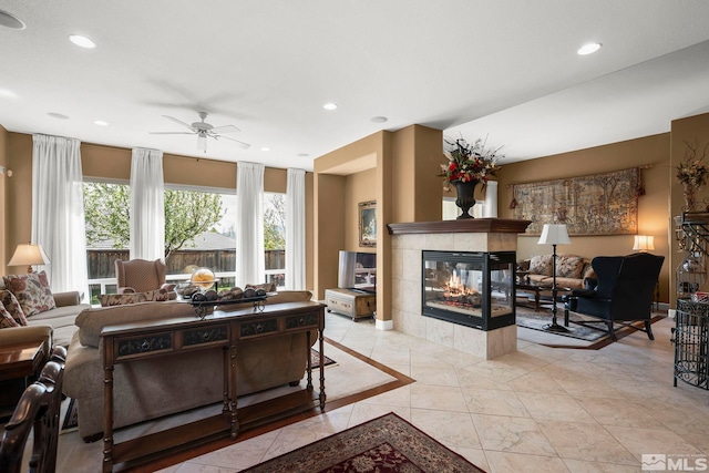 2370 Hickory Hl, Reno, NV 89523 - living room with a ceiling fan, a tiled fireplace, recessed lighting, and baseboards