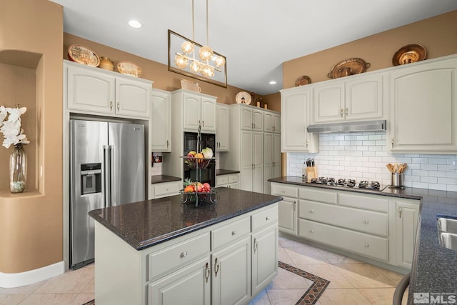 2370 Hickory Hl, Reno, NV 89523 - kitchen featuring stainless steel refrigerator with ice dispenser, gas cooktop, under cabinet range hood, backsplash, and white cabinets