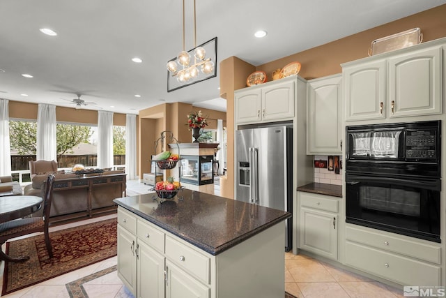 2370 Hickory Hl, Reno, NV 89523 - kitchen with black appliances, a kitchen island, recessed lighting, a ceiling fan, and white cabinetry