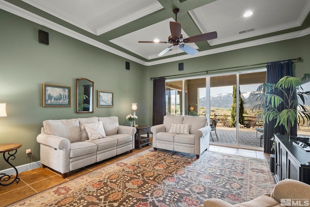 tiled living room featuring crown molding, a ceiling fan, beamed ceiling, coffered ceiling, and a mountain view