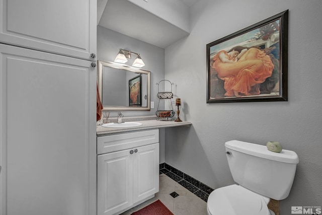 200 W 2nd St Unit 1202, Reno, NV 89501 - bathroom featuring tile patterned floors, baseboards, vanity, and toilet