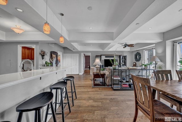 200 W 2nd St Unit 1202, Reno, NV 89501 - dining room featuring light wood-style flooring, ceiling fan, recessed lighting, and a tray ceiling