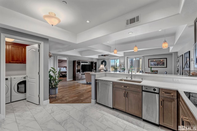 200 W 2nd St Unit 1202, Reno, NV 89501 - kitchen featuring dishwasher, a sink, washer and clothes dryer, open floor plan, and light marble finish flooring