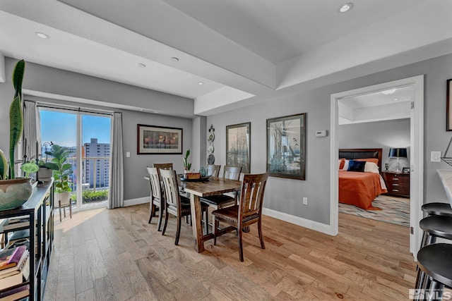 200 W 2nd St Unit 1202, Reno, NV 89501 - dining space with baseboards, light wood-style floors, and recessed lighting