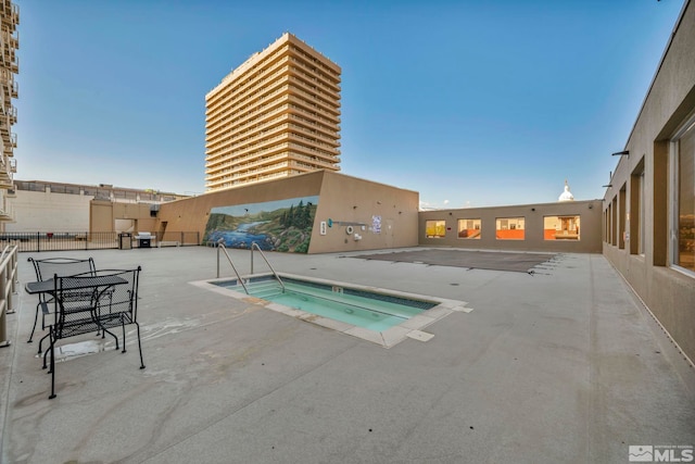 200 W 2nd St Unit 1202, Reno, NV 89501 - view of swimming pool featuring a hot tub