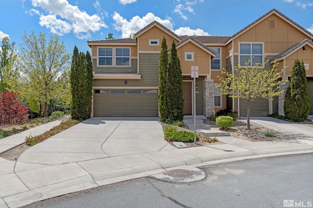 4845 Bougainvillea Cir, Sparks, NV 89436 - multi unit property with concrete driveway, a garage, and stone siding