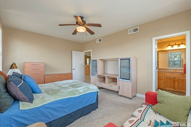 4845 Bougainvillea Cir, Sparks, NV 89436 - bedroom featuring light carpet, a ceiling fan, ensuite bathroom, and baseboards
